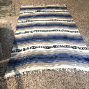 Rug or throw blanket Blue tan off white and black pattern.